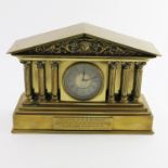A late Victorian brass desk timepiece, of classical architectural form with pediment, Corinthian