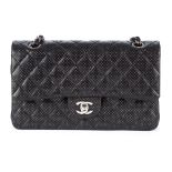 Chanel, a black perforated Medium Double Flap handbag