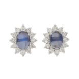 A pair of moonstone and diamond cluster stud earrings