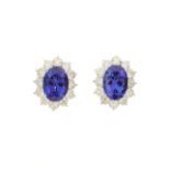 An impressive pair of 18ct gold tanzanite and diamond cluster stud earrings