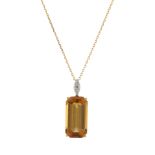 An 18ct gold citrine and diamond pendant, with chain