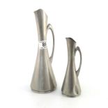 A graduated pair of Norwegian Modernist pewter jugs