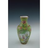 A 19th Century Cantonese enamel baluster vase, decorated with cartouche panels of fashionable ladies