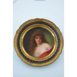 A late 19th Century Vienna cabinet plate, painted with a portrait of a semi-nude female with