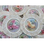 C Hart for Royal Doulton, twelve rose painted porcelain cabinet plates