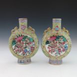 A pair of 19th Century Chinese moonflasks, zoomorphic gilt twin handles, famille rose decorated with