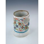 An 18th Century Chinese porcelain watch stand, of cartouche from with applied foliage, polychrome