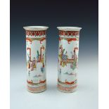 A pair of 19th Century Chinese cylinder sleeve vases, decorated in iron red, gilt and polychrome