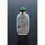 A Chinese opaque glass snuff bottle, internally painted with a bird on a prunus blossom branch,