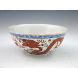 A Chinese bowl, gently flared rim, the exterior polychrome painted in raised enamels with a Greek