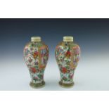 A pair of 19th Century Cantonese enamel Meiping vases, famille rose decoration of panels of