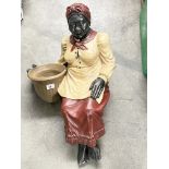 A seated Blackamoor figure of a washerwoman, 70cm