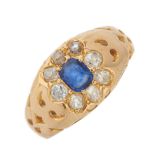 An early 20th century 18ct gold sapphire and diamond cluster dress ring