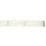 A four-row cultured pearl bracelet, with 18ct gold diamond and pearl clasp
