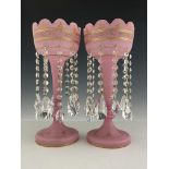 A pair of Victorian pink satin glass lustres, circa 1870, castellated rims, gilt and raised gilt