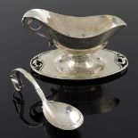 George Jensen, a Danish Jugendstil silver Magnolie pattern sauce boat