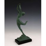 An Art Deco patinated art metal figure of a dancer