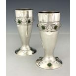 Archibald Knox for Liberty and Co., a pair of Arts and Crafts Cymric silver and cabochon set vases
