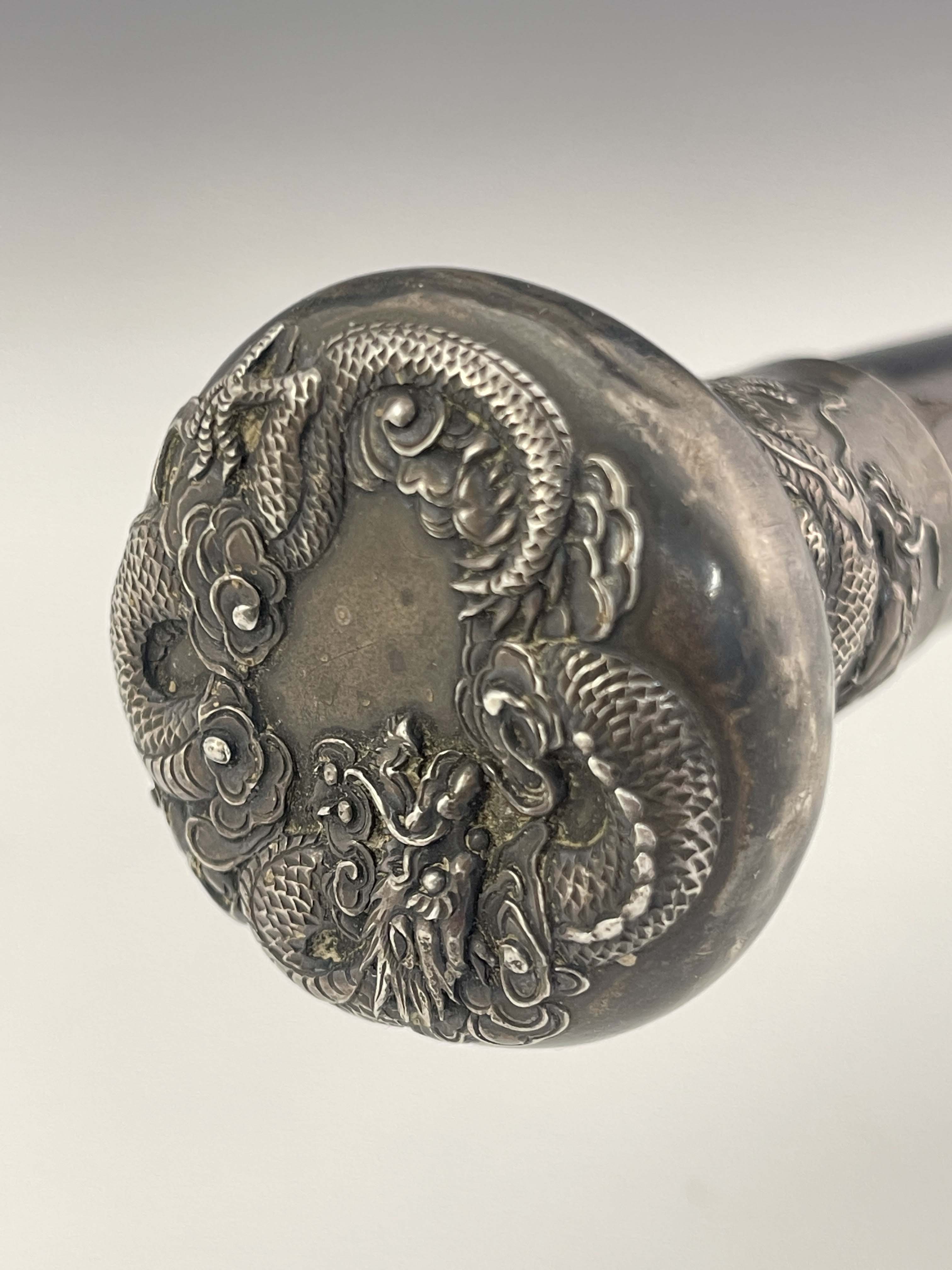 A Chinese export silver knopped cane, circa 1900, pommel head embossed in high relief with - Image 2 of 3