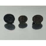 Three Georgian pewter pocket seal fobs, scroll mounts with ring suspension hooks, one with