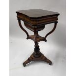 A Regency rosewood work table, circa 1820, canted octagonal hinged top opening to a fitted interior,