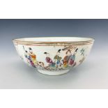 An 18th Century Chinese sideboard bowl, cafe au lait rim, famille rose decoration with seated