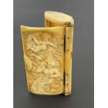 A bone pocket snuff box, 19th Century, the hinged cover carved in relief with a semi-nude female and