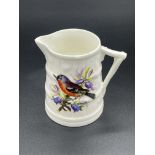 John Hopewell (attributed) for Royal Worcester, a bird painted barrel jug, decorated with chaffinch,