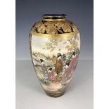 A Japanese satsuma ware baluster vase, Meiji period, 1868-1912, painted with a panel of