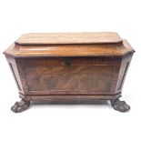 A Regency mahogany cellarette, circa 1825, of sarcophagus form, crossbanded hinged cover with 'stay'