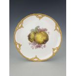 A KPM fruit painted plate depicting quince within relief moulded border, together with a late 19th
