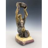 A French Art Deco patinated art metal figure