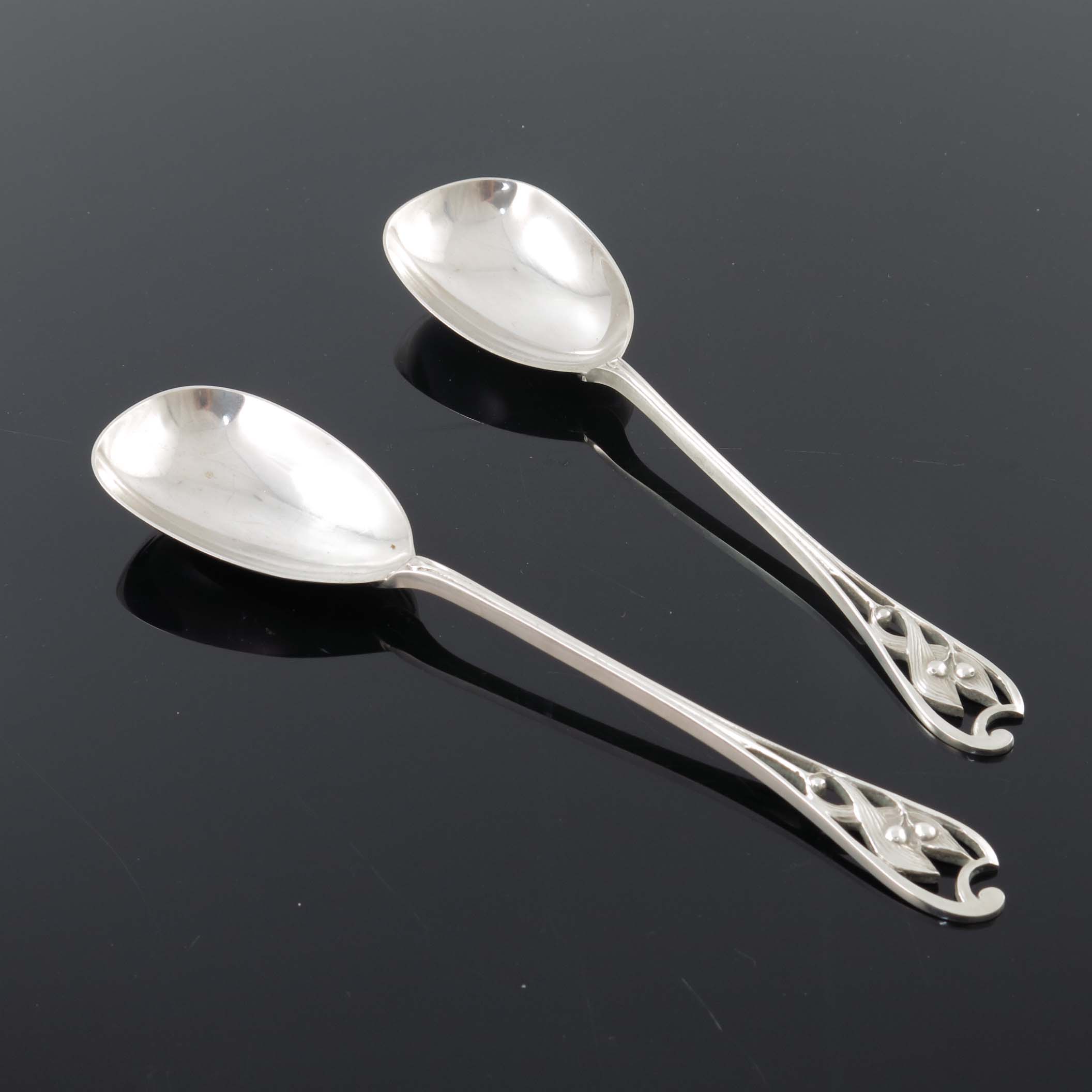 Kate Harris for William Hutton, a pair of Arts and Crafts silver serving spoons, London 1901, the