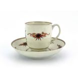 A Worcester polychrome coffee cup and saucer