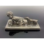 WMF, a silver plated figure group of a crying baby being pulled by a dachshund puppy