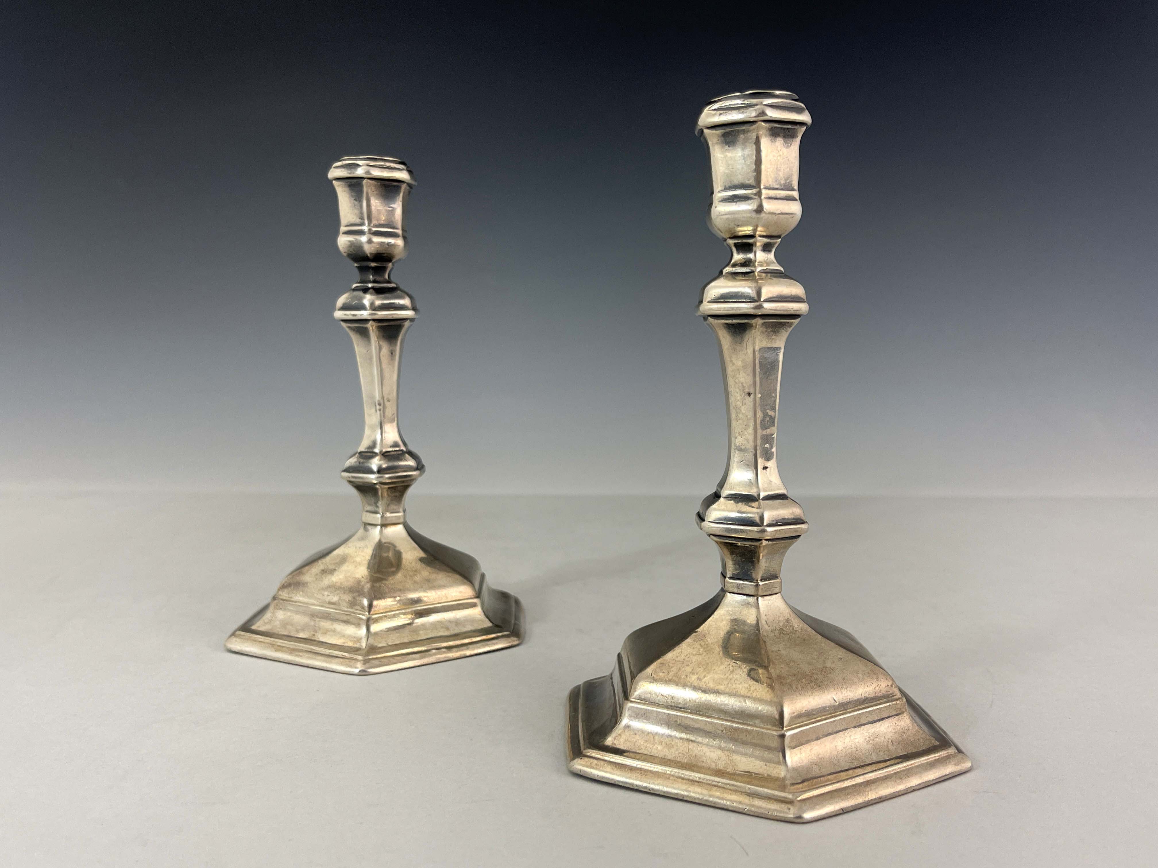 A pair of George I silver candlesticks, Matthew Cooper, London 1718, hexagonal form, on stepped