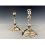 A pair of George I silver candlesticks, Matthew Cooper, London 1718, hexagonal form, on stepped