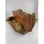 A George VI Mappin & Webb dressing case, monogrammed canvas foul weather cover, tan leather case