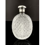 A George V silver mounted and cut glass flask, London 1922, oval form glass body cut with a