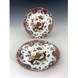 A pair of Imari dishes, circular form, enamelled with peony branches and bowls of pomegranates and