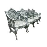 A set of four Victorian cast iron 'Four Seasons' garden armchairs, circa 1862, designed by W.