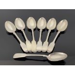 A matched set of seven Victorian and Edwardian silver dessert spoons