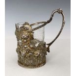An Elizabeth II silver embossed tea glass holder