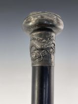 A Chinese export silver knopped cane, circa 1900, pommel head embossed in high relief with