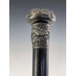 A Chinese export silver knopped cane, circa 1900, pommel head embossed in high relief with