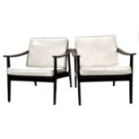 A pair of lounge armchairs, circa 1950s, in the manner of Ole Wanscher, stained beech frames with