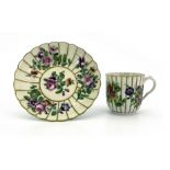A Worcester polychrome cup and saucer,