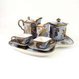 A Royal Worcester Aesthetic Movement breakfast set, 1878, in the Japanesque style, triangular form