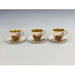 Harry Stinton for Royal Worcester, a set of three Highland cattle painted cups and saucers, gilt