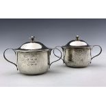 A pair of Arts and Crafts silver twin handled and lidded porringers, Goldsmiths and Silversmiths Com